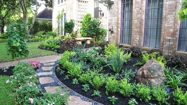 Planted landscape bed beside a home